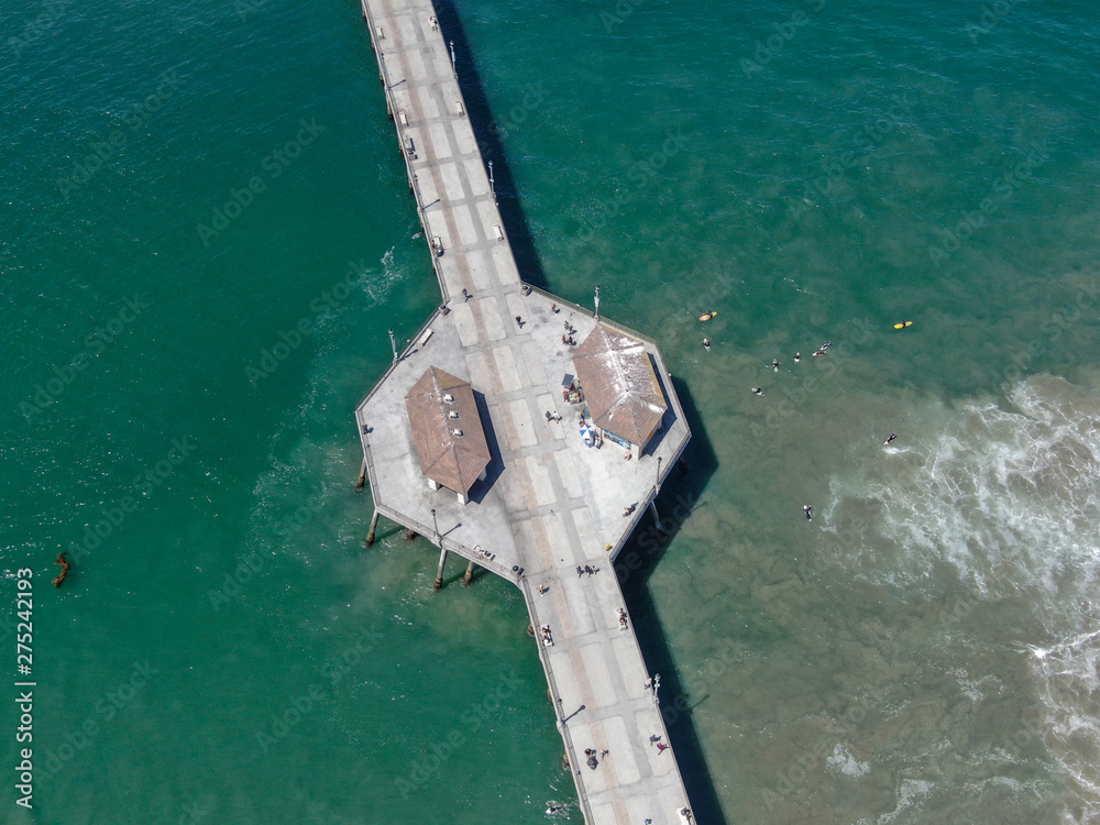 Aerial view of Huntington Pier during sunny summer day, Southeast of Los Angeles. California. destination for surfer and tourist.