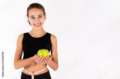 Young athletic girl isolated on white background.