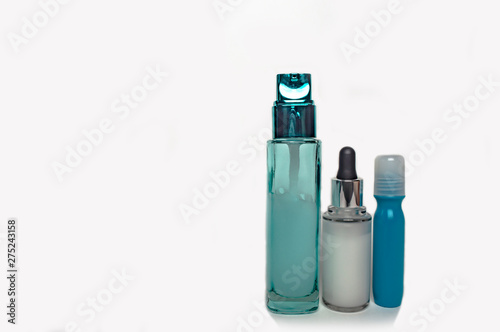 glass jars for cosmetic creams on a white background