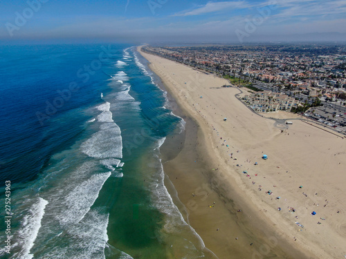 Aerial view of Huntington Beach and coastline during hot blue sunny summer day, Southeast of Los Angeles. California. destination for  holiday and surfer © Unwind