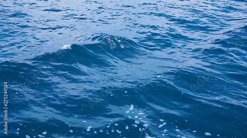 Close up of disturbed blue ocean water surface. Beauty background