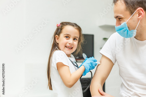 Little girl makes injection