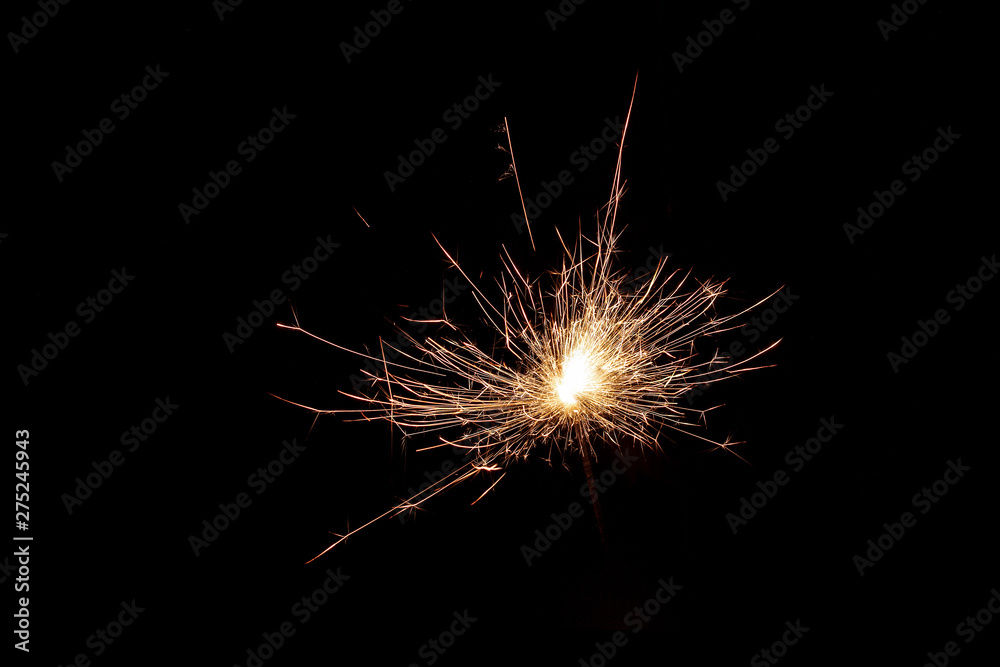 Close up shot of firework sparkler burning, burning sparkler isolated on black background Close up shot of firework sparkler burning, burning sparkler isolated on black background