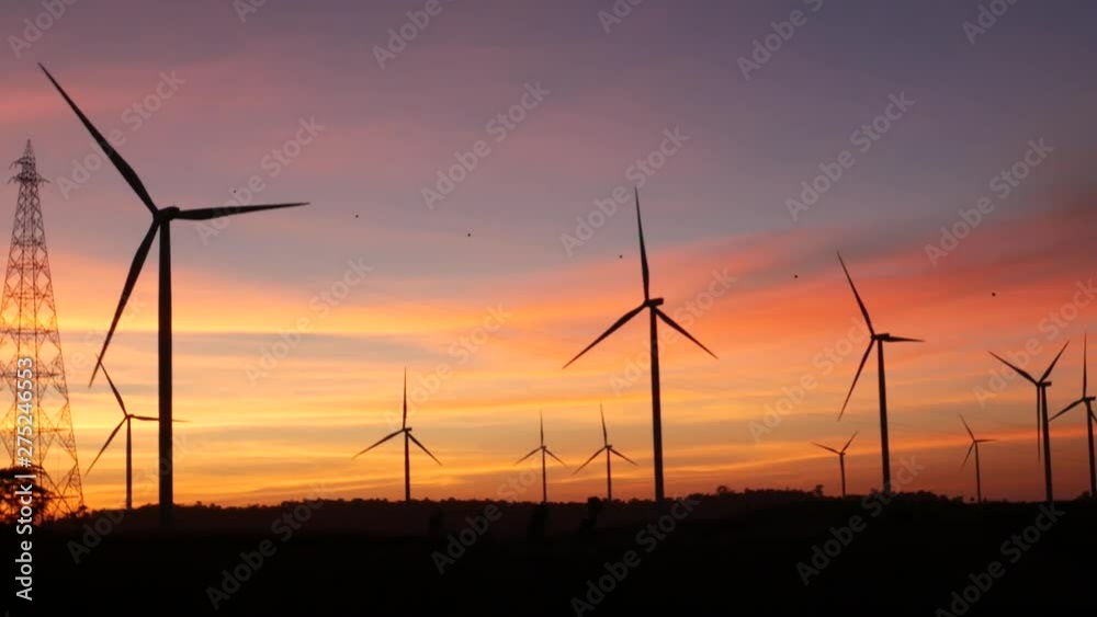 Horizontal Axis Wind Turbine, Wind turbines and power lines against sunset. The clean energy system in Khao Kho District, Phetchabun province, Thailand. Horizontal Axis Wind Turbine, Wind turbines and power lines against sunset. The clean energy system in Khao Kho District, Phetchabun province, Thailand.
