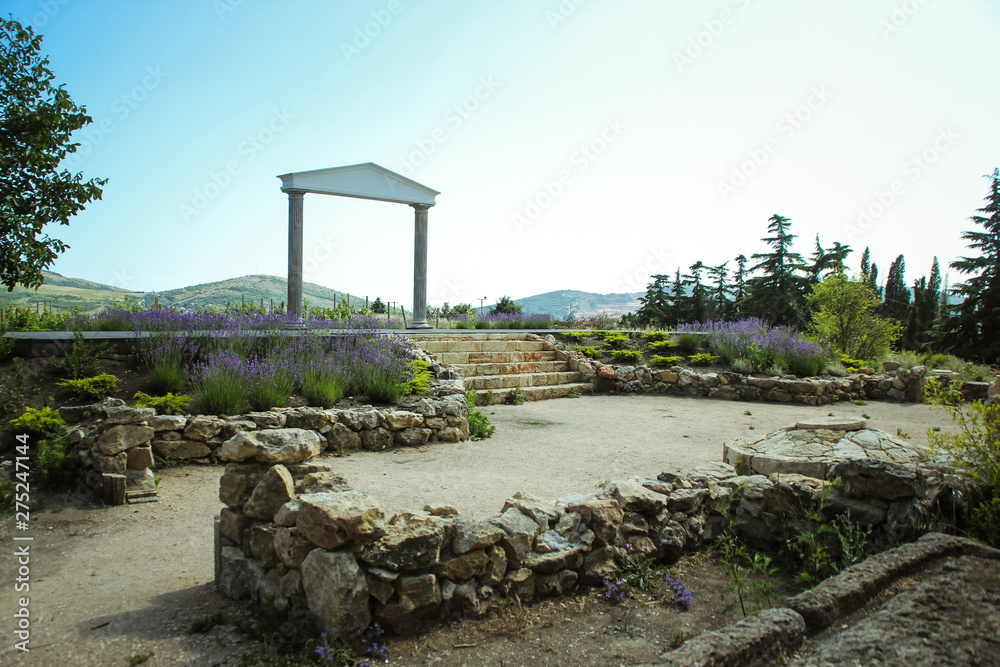 The wonderful Greek arch. amazing views of the vineyards and mountains of Crimea and flowering lavender. beautiful landscape of mountains and grapes and lavender The wonderful Greek arch. amazing views of the vineyards and mountains of Crimea and flowering lavender. beautiful landscape of mountains and grapes and lavender