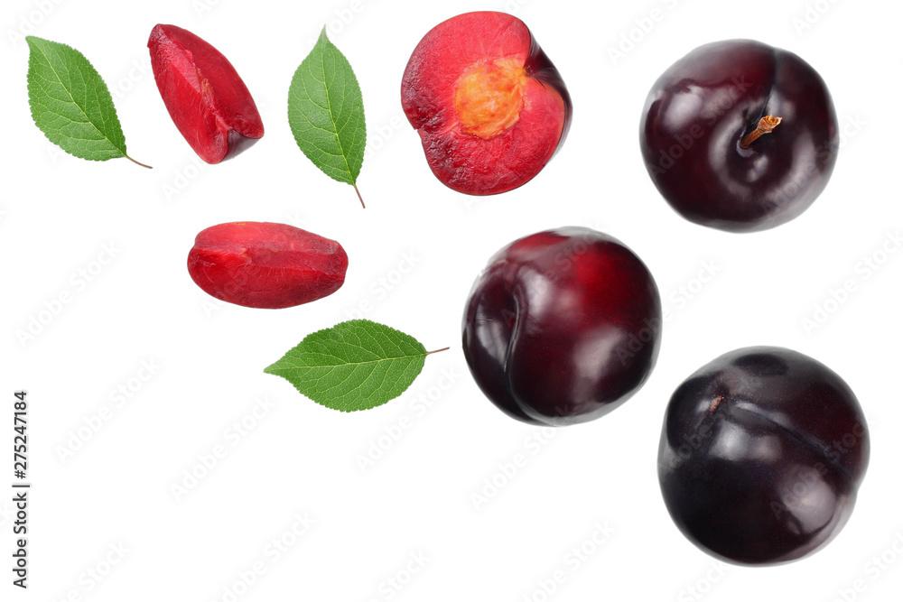 fresh plum fruit with green leaf and cut plum slices isolated on white background. top view fresh plum fruit with green leaf and cut plum slices isolated on white background. top view