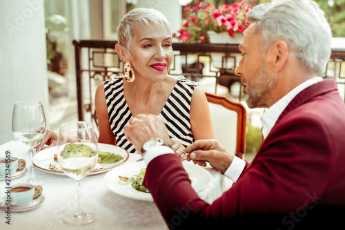 Couple of aged husband and wife enjoying dinner outside