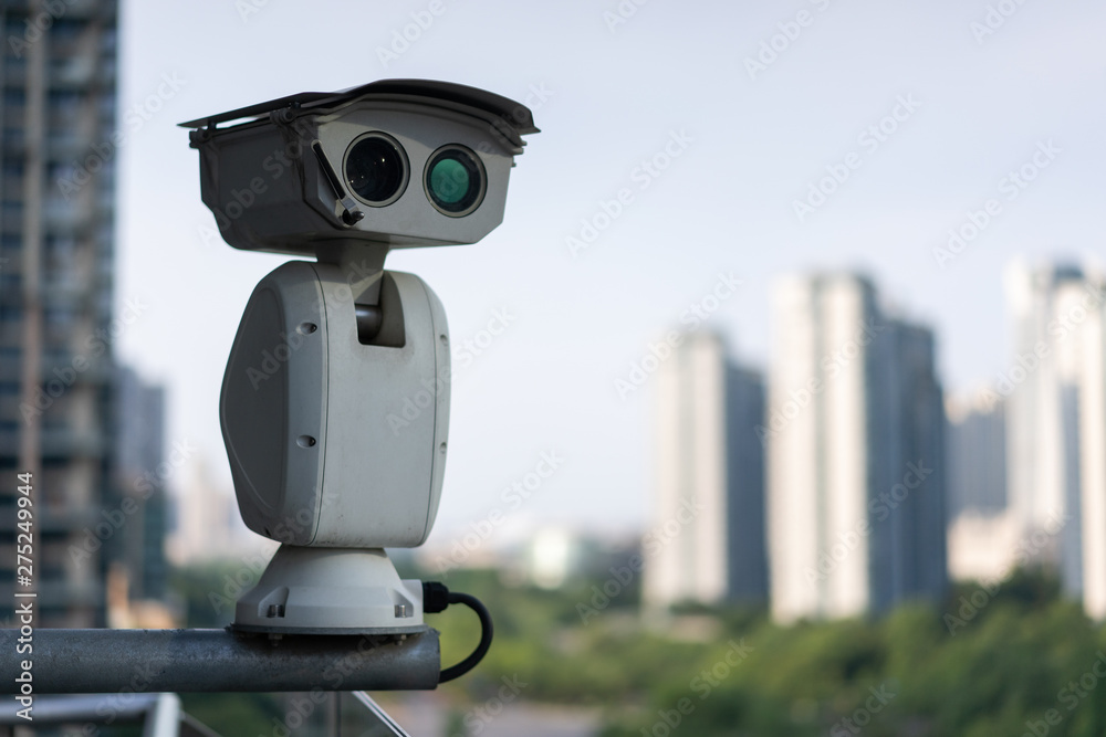 cctv camera with city skyline cctv camera with city skyline
