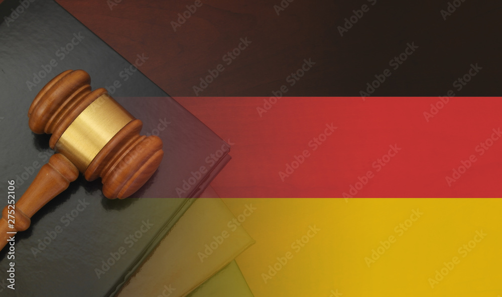 Gavel and legal book on wooden table, collage with german flag