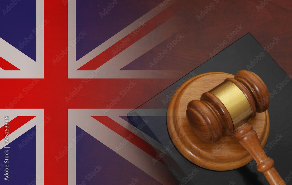 Gavel and legal book on wooden table, collage with united kingdom flag