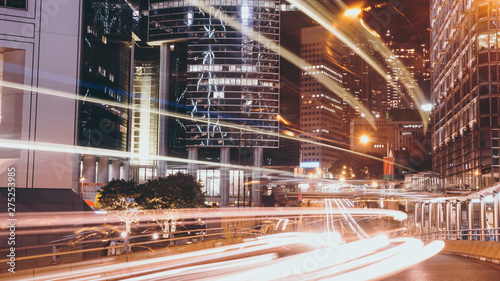 Traffic light trails rushing through the Central & Admiralty district in the heart of Hong Kong’s business areas at night. photo