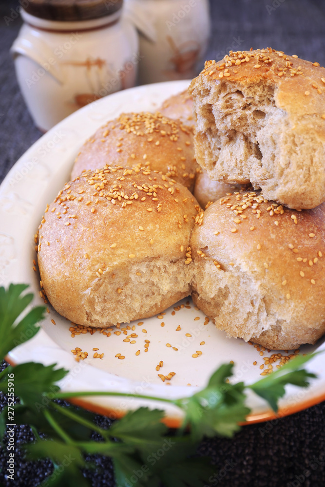 Fresh homemade sourdough bread buns with sesame Fresh homemade sourdough bread buns with sesame