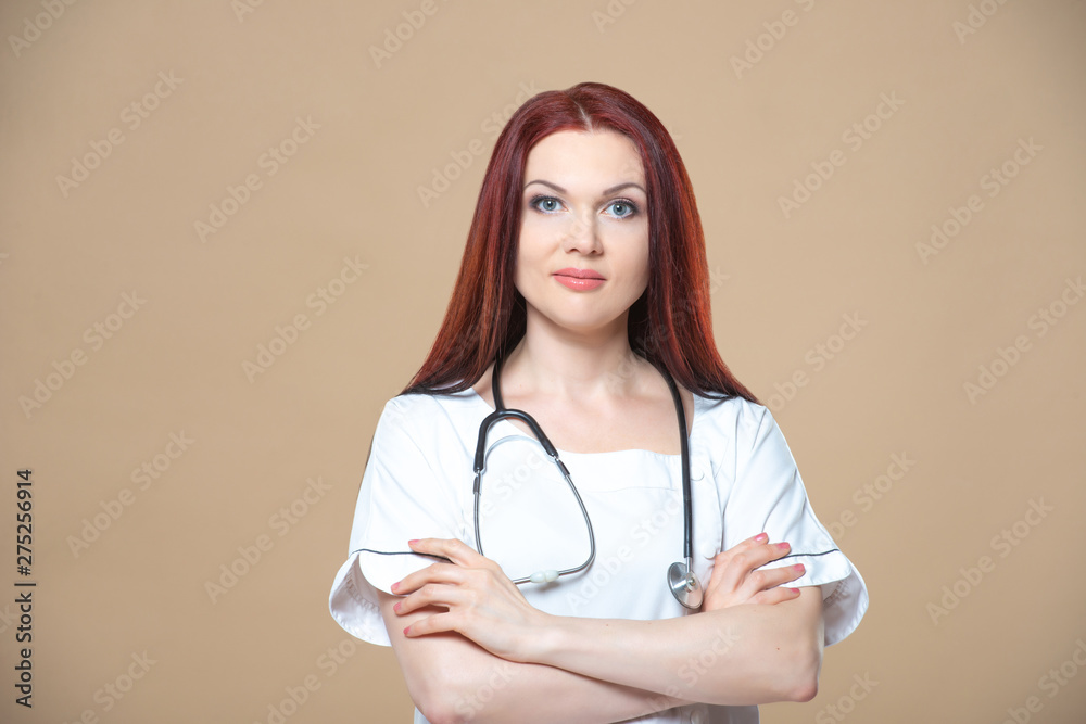 Female profession. Good family, children's, woman pediatrician or nurse with a stethoscope isolated on a blue background. Concept medical consultation Female profession. Good family, children's, woman pediatrician or nurse with a stethoscope isolated on a blue background. Concept medical consultation