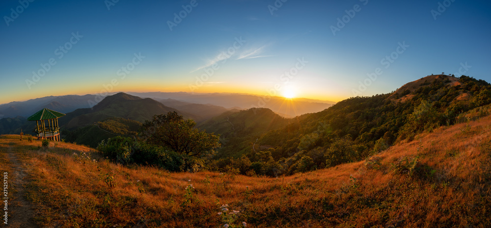 Panorama photo. Scenic sunset and mountain view between the hiking route to Doi pui ko, Mae hong son, Thailand.