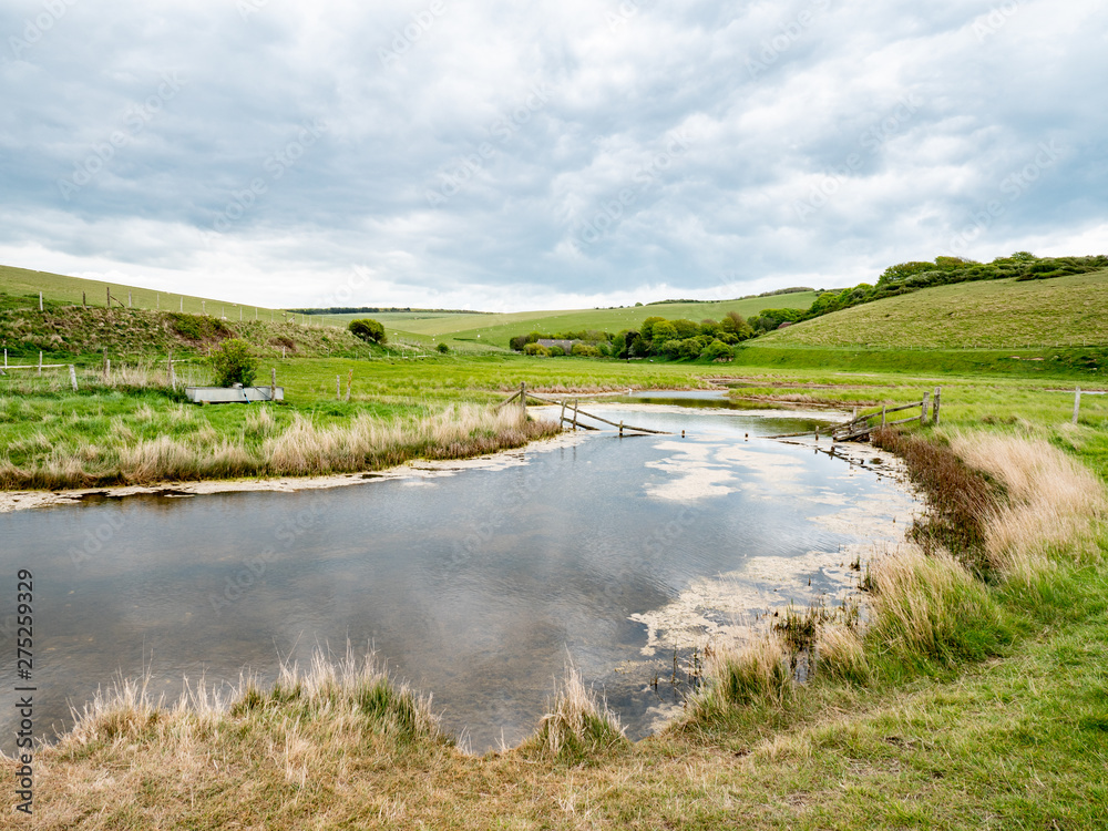 River Cuckmere, Sussex, England. The flood plains of Cuckmere Haven at the Seven Sisters park in the English South Downs nature reserve.