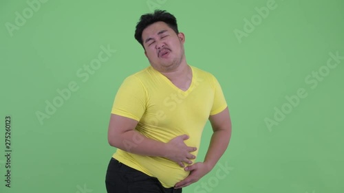 Funny young overweight Asian man farting