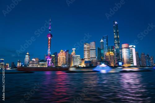 Shanghai  China - JUN 21   2018  Nightscape of Lujiazui skyline as seen from the Bund  across the Huangpu. Zoom to across the night view. Night panorama of beautiful Shanghai city with bright lights 