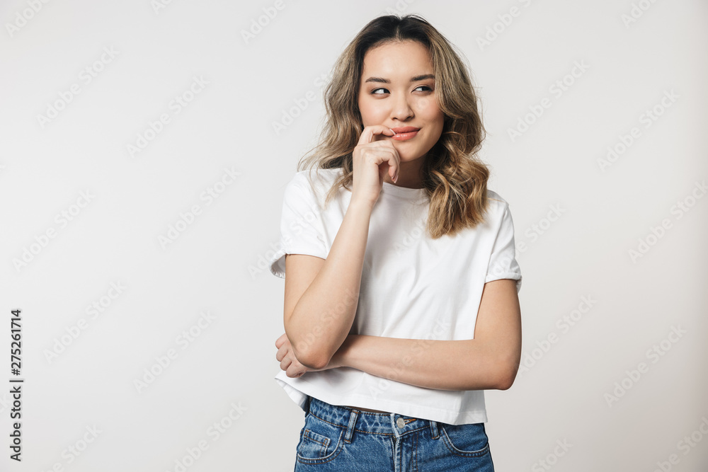 Portrait of a lovely young asian woman standing isolated Portrait of a lovely young asian woman standing isolated