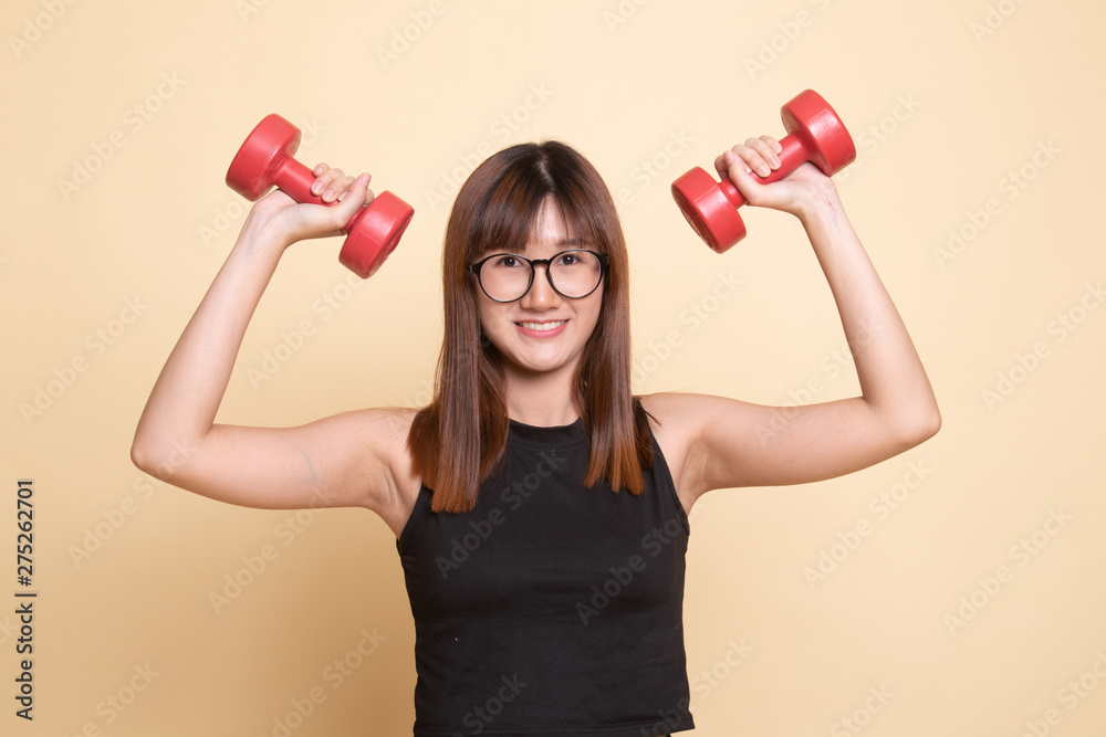 Healthy Asian woman with dumbbells. Healthy Asian woman with dumbbells.