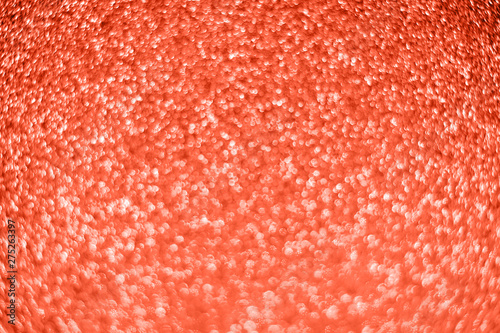 Bright sparkle coral background. Holiday and festive concept.