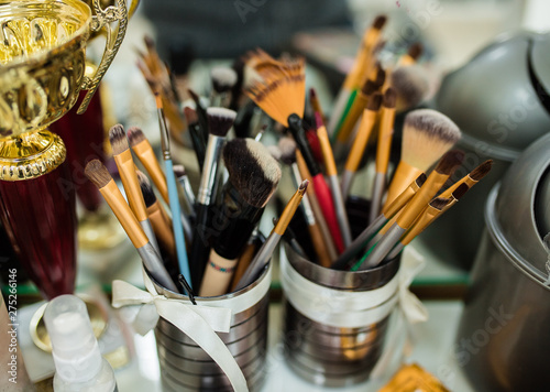 makeup artist tools. Large brush, powder, a set of different items for makeup artist. paint makes beautiful. make.