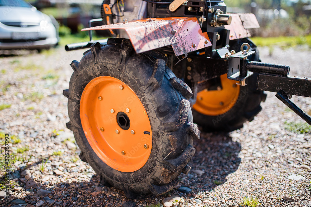 Large dump truck wheels on the ground. tractor wheel close-up. Large dump truck wheels on the ground. tractor wheel close-up.