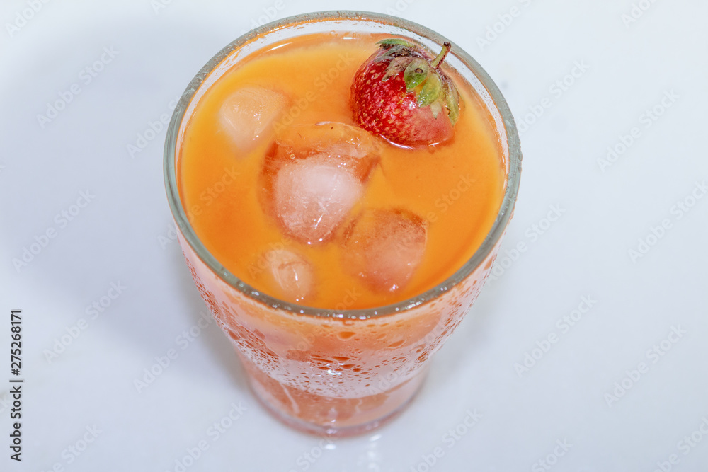 Сarrot juice with strawberries and ice Сarrot juice with strawberries and ice