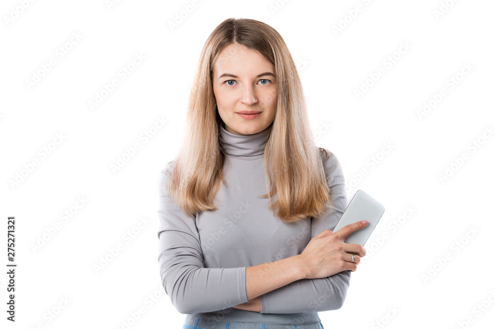 The theme of a business woman and telephone conversations. Beautiful young caucasian woman uses a smartphone handset to call in formal clothes on a white isolate background