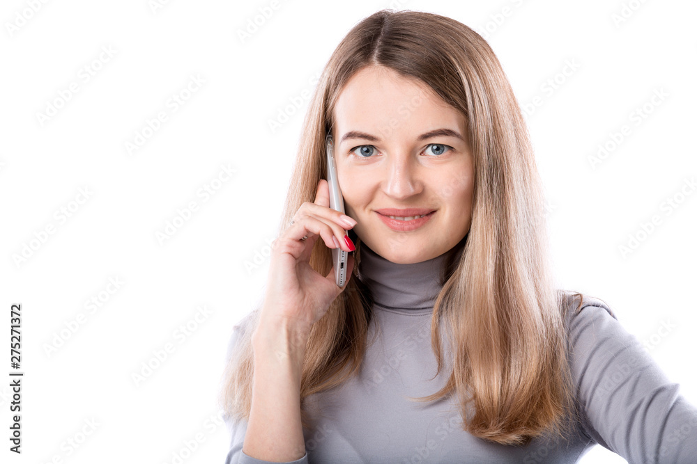 The theme of a business woman and telephone conversations. Beautiful young caucasian woman uses a smartphone handset to call in formal clothes on a white isolate background The theme of a business woman and telephone conversations. Beautiful young caucasian woman uses a smartphone handset to call in formal clothes on a white isolate background