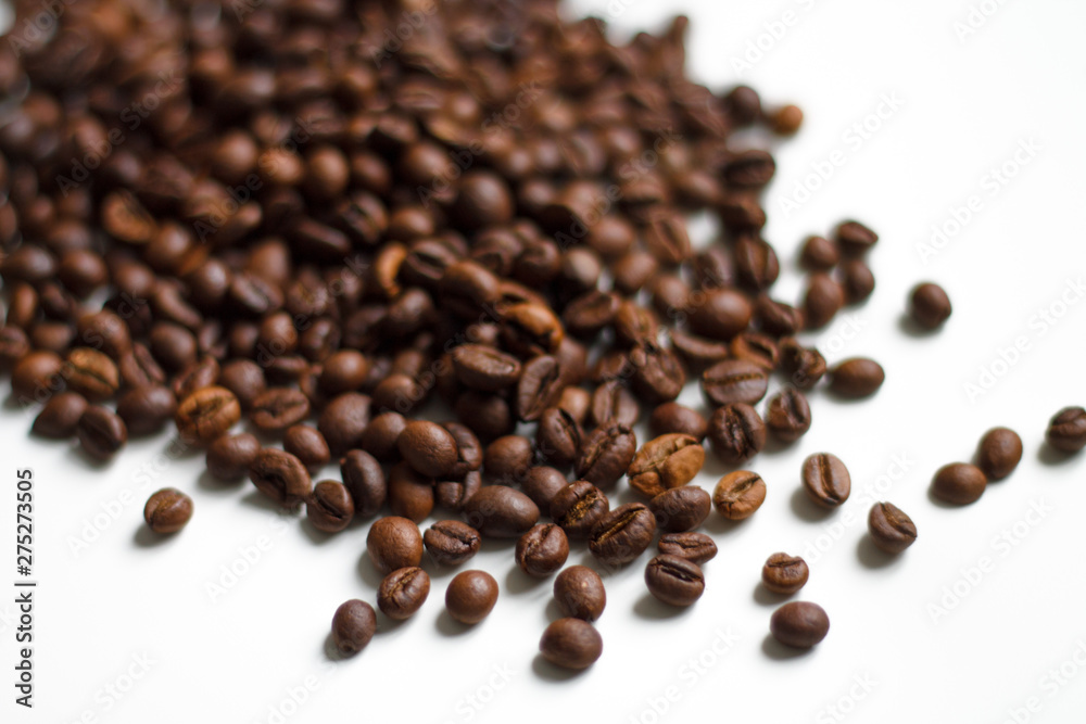 coffee beans brown on white isolated background with close-up location with blurred background coffee beans brown on white isolated background with close-up location with blurred background