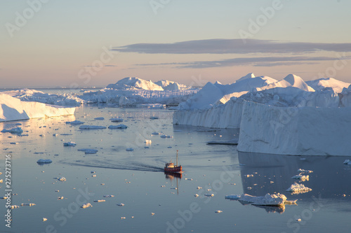 Red Fishing Boat in Ilulissat Icefjrod photo