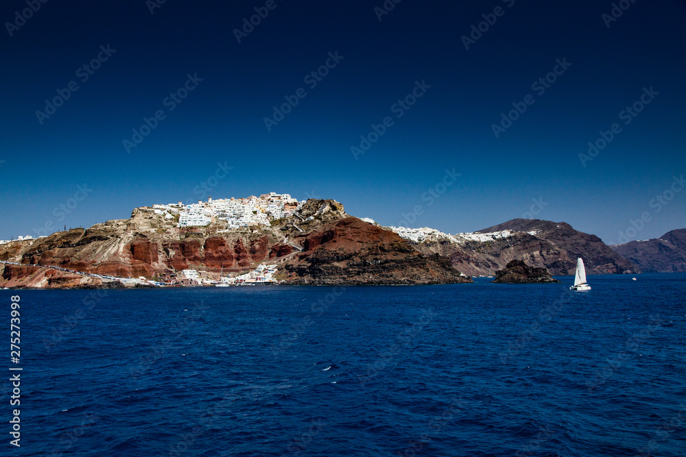 view of the caldera and Oia in Santorini from the sea, Cyclades islands Greece - amazing travel destination