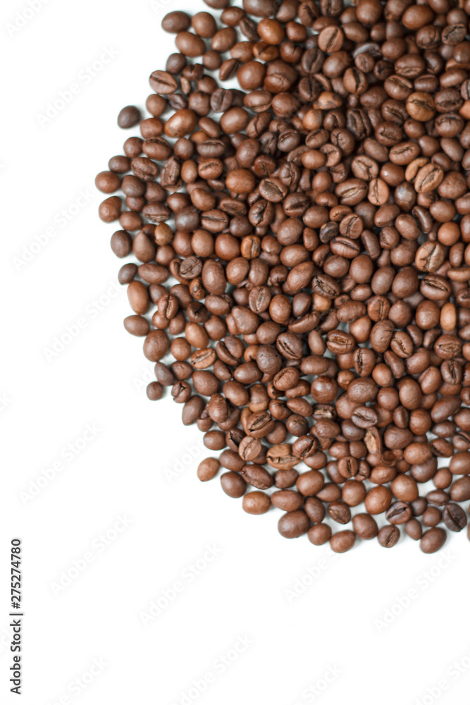 brown coffee grains on a white isolated background with space top view brown coffee grains on a white isolated background with space top view