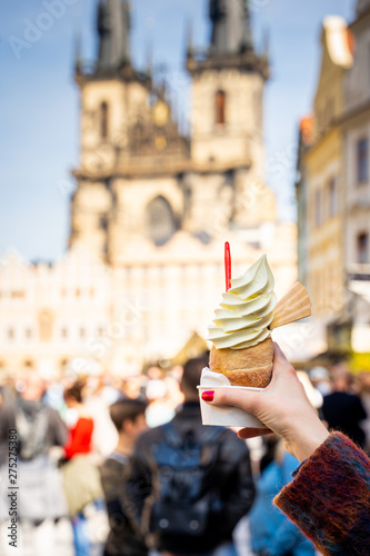 Traditional Tasty Baked Trdelnik with Ice Cream in Czech Republic, Tyn Church on the Background
