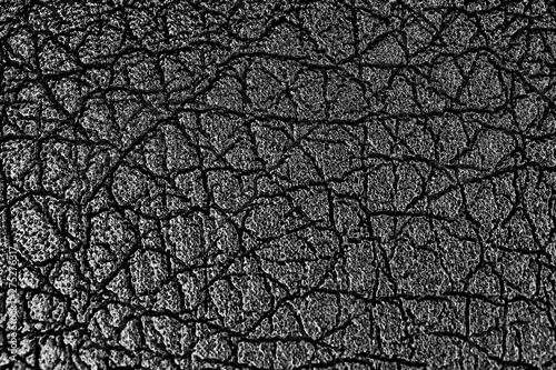 Black eco leather in macro abstract close up with relief texture
