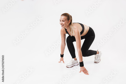 Attractive young fit sportswoman standing