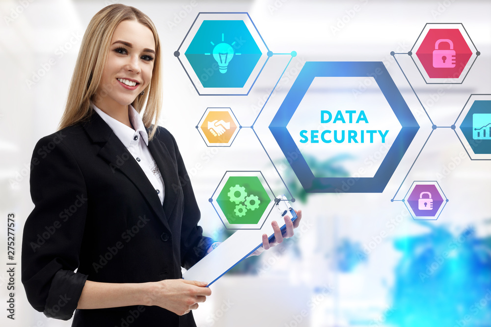 The concept of business, technology, the Internet and the network. A young entrepreneur working on a virtual screen of the future and sees the inscription: Data security The concept of business, technology, the Internet and the network. A young entrepreneur working on a virtual screen of the future and sees the inscription: Data security