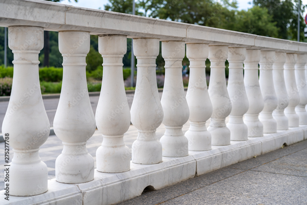 Fototapeta premium white palace railings with blown props. Beautiful classical architecture. Luxury street railings.
