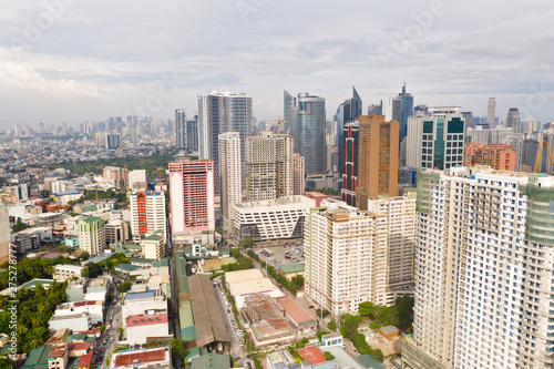 The city of Manila, the capital of the Philippines. Modern metropolis in the morning, top view. New buildings in the city. Panorama of Manila. Skyscrapers and business centers in a big city. photo