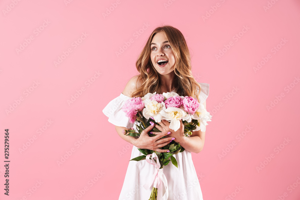 Beautiful young blonde girl wearing summer dress