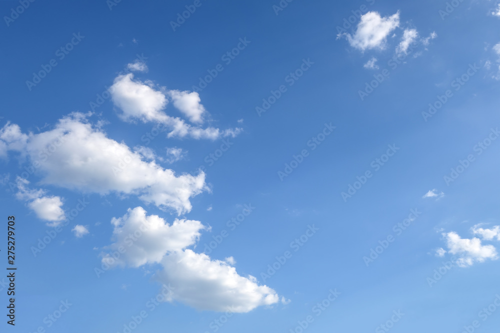 Fototapeta premium light fluffy clouds on a bright blue sky