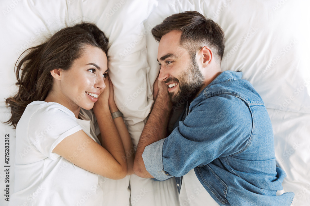 Beautiful young couple in love at home