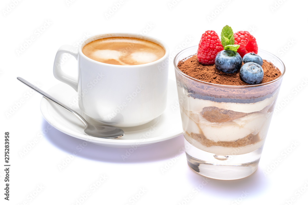 Cup of cofee and Classic tiramisu dessert with blueberries and raspberries in a glass isolated on a white background with clipping path Cup of cofee and Classic tiramisu dessert with blueberries and raspberries in a glass isolated on a white background with clipping path