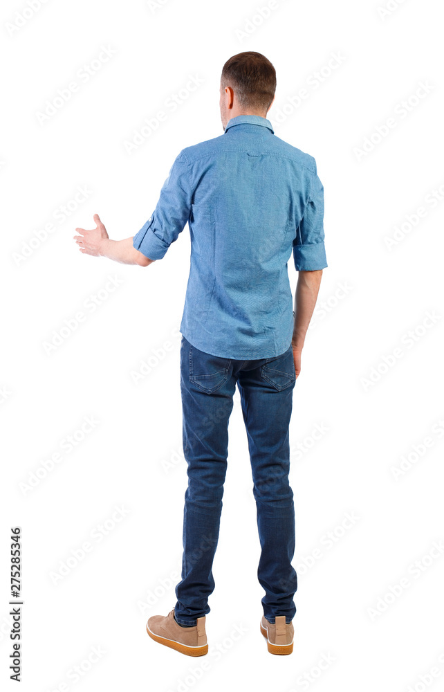 Back view of a man who stretches his hand for a handshake. Back view of a man who stretches his hand for a handshake.