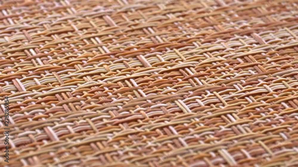The texture of the fabric. Beige wicker fabric. Close-up. Can be used as a background.