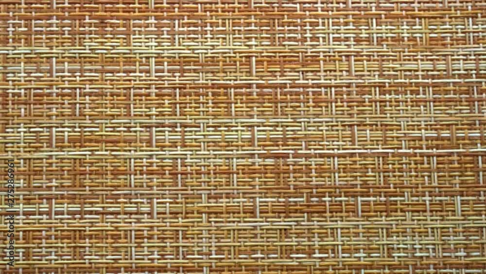The texture of the fabric. Beige wicker fabric. Close-up. Can be used as a background.