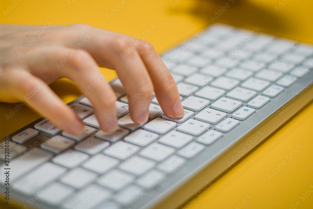 Modern office with keyboard. Top view with copy, keyboard isolated on yellow background Modern office with keyboard. Top view with copy, keyboard isolated on yellow background