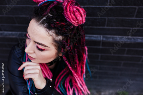 Beautiful colored girl dreads on the street