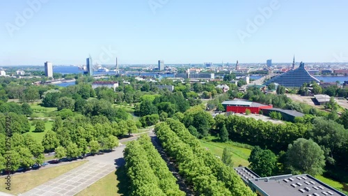 Aerial View Of Victory Monument In Riga (Uzvaras Piemineklis), Fly Away From National Library, Beautiful Sunny Day photo