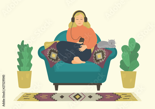 Woman relaxing and listenning podcasts, online trainings, music, or online radio.